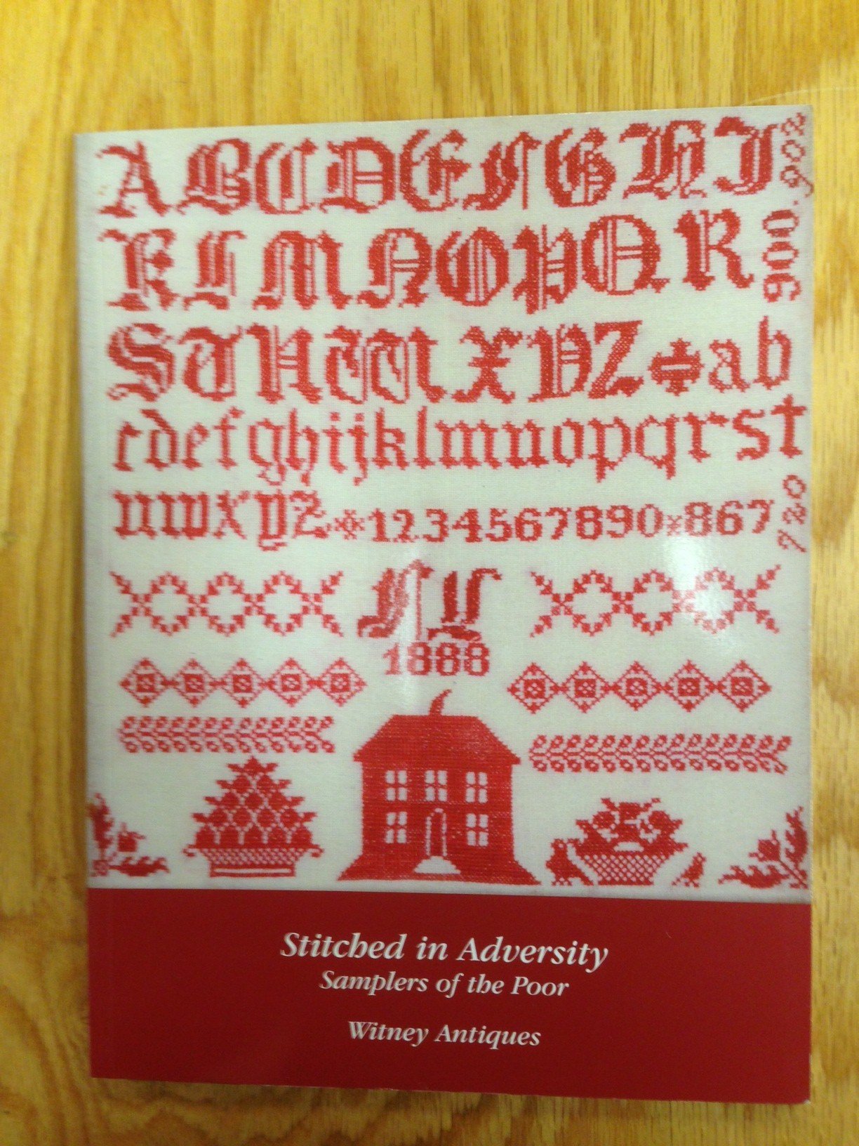 Stitched in Adversity: Sampler of the Poor